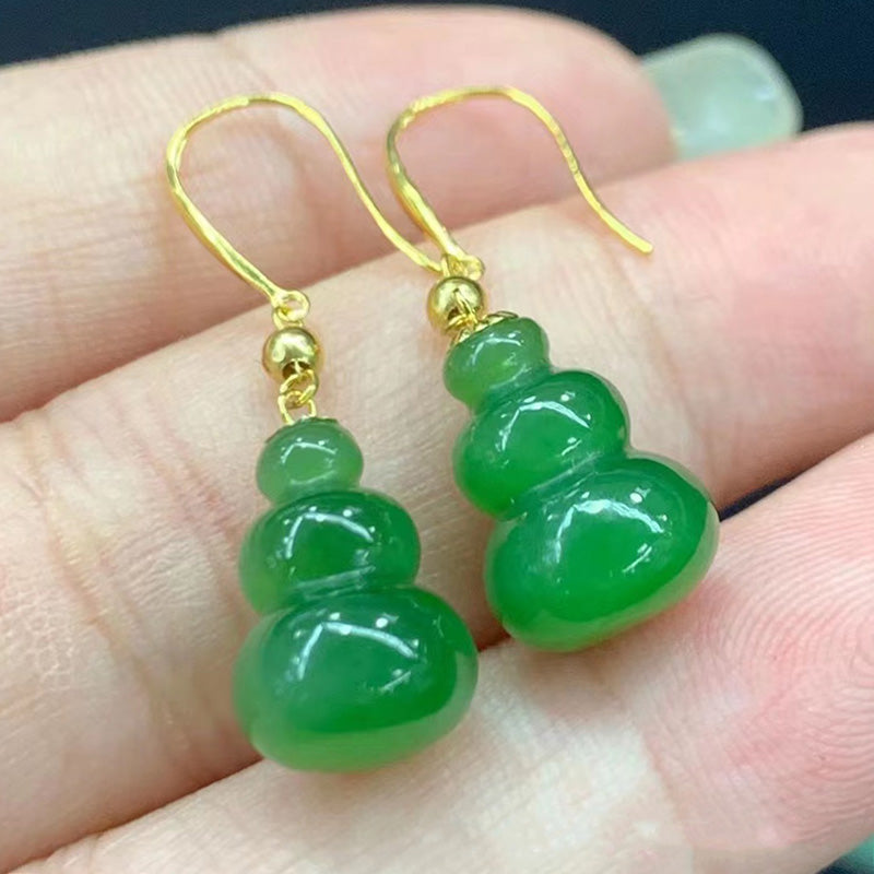 Exquisite jade gourd earrings with 18K gold accessories, showcasing the unique charm of the traditional gourd shape