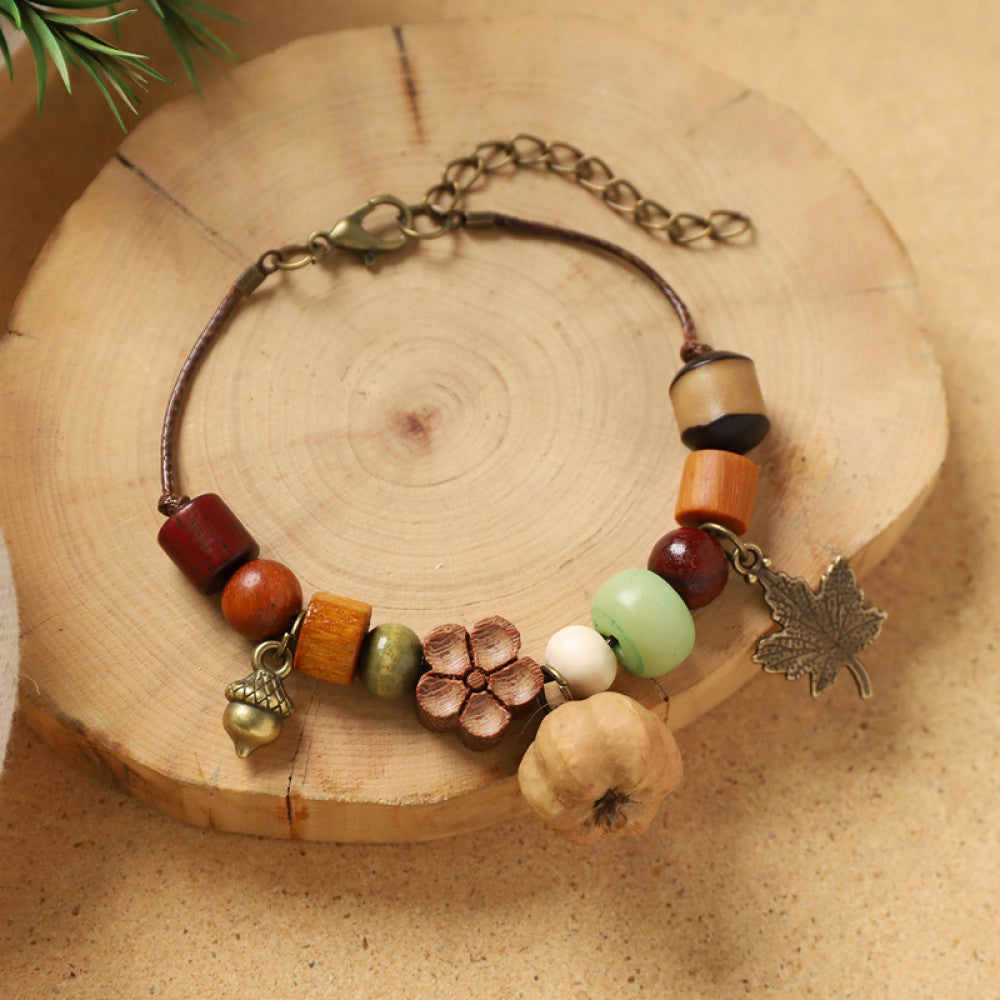 Close-up of the acorn charm, highlighting texture and craft.