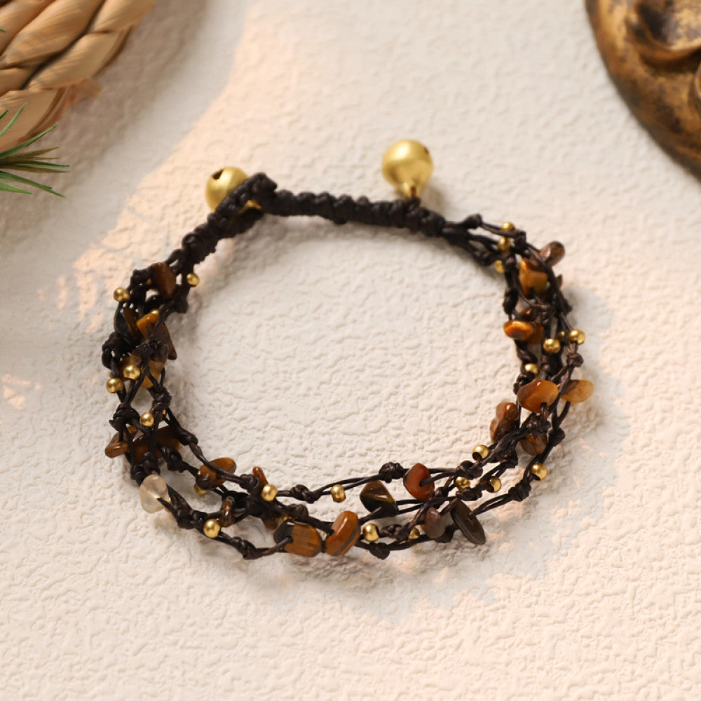 This multi-layered bohemian bracelet features black braided cords adorned with natural amethyst chips and gold beads, finished with golden accent beads. A unique, earthy accessory for everyday style 04