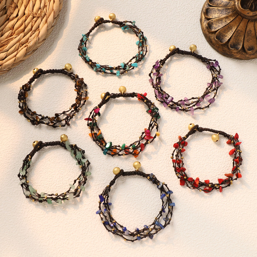 This multi-layered bohemian bracelet features black braided cords adorned with natural amethyst chips and gold beads, finished with golden accent beads. A unique, earthy accessory for everyday style 08