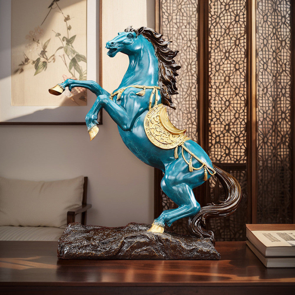 Blue horse statue with golden accents, a Feng Shui symbol of success and good fortune, displayed as elegant home decor against a red background 01