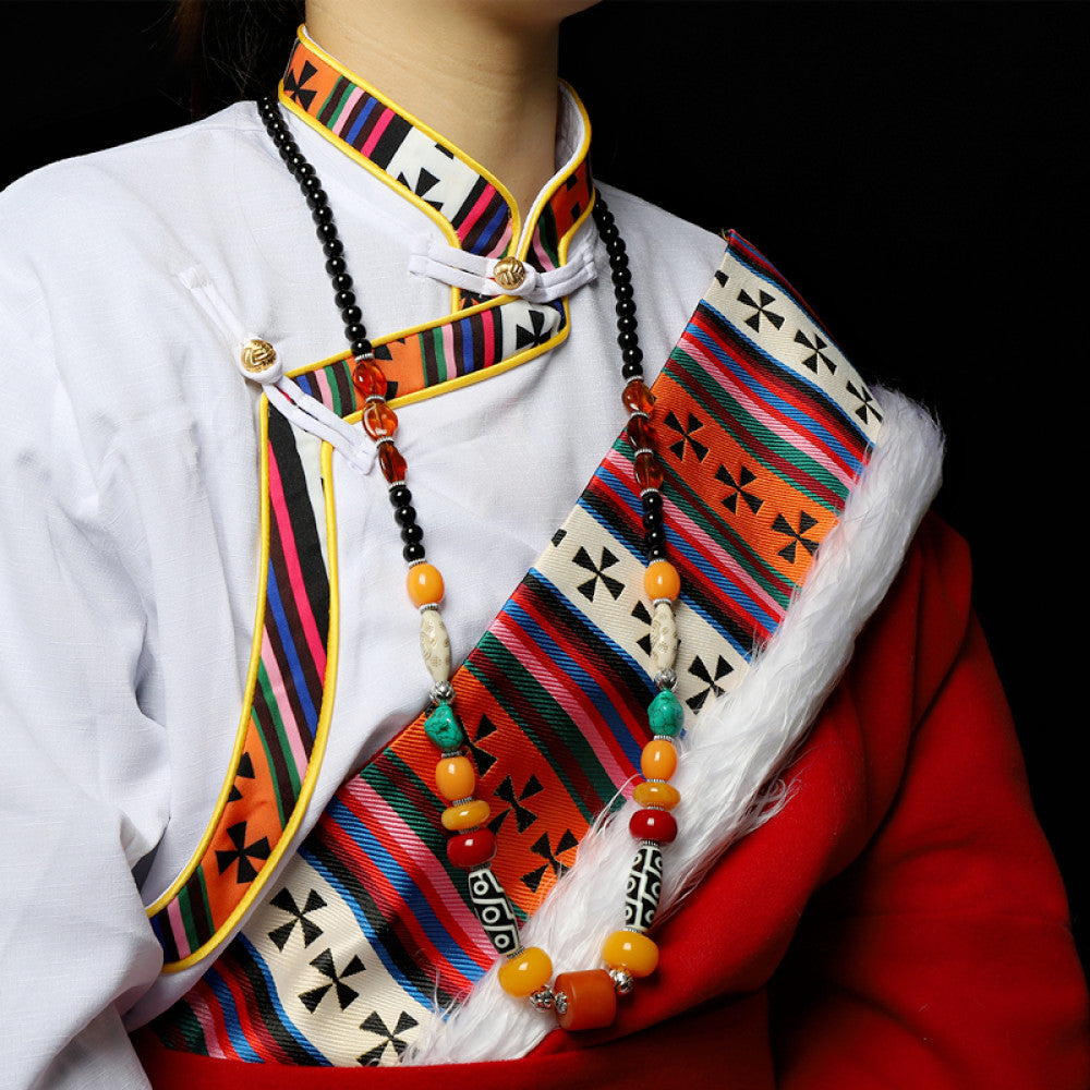 Vintage Bohemian ethnic tribal multi-color beaded necklace with Tibetan style design, showcased on a model in traditional ethnic attire, ideal for boho fashion enthusiasts
