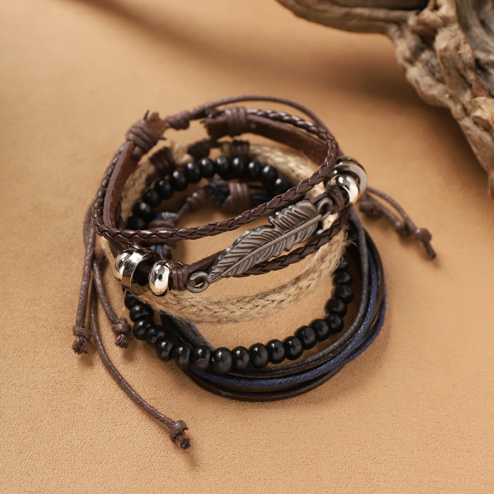 This bohemian stackable bracelet set features multiple layered strands in earthy tones, including turquoise, dark brown, green, and light brown beads, accented with decorative silver elements. The mix of natural materials and ethnic-inspired details creates a rich, textured look, perfect for layering to elevate casual outfits 02