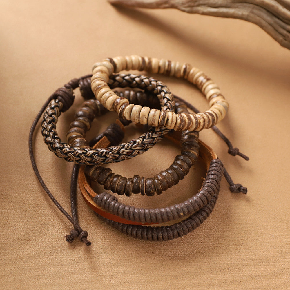 This bohemian stackable bracelet set features multiple layered strands in earthy tones, including turquoise, dark brown, green, and light brown beads, accented with decorative silver elements. The mix of natural materials and ethnic-inspired details creates a rich, textured look, perfect for layering to elevate casual outfits 05