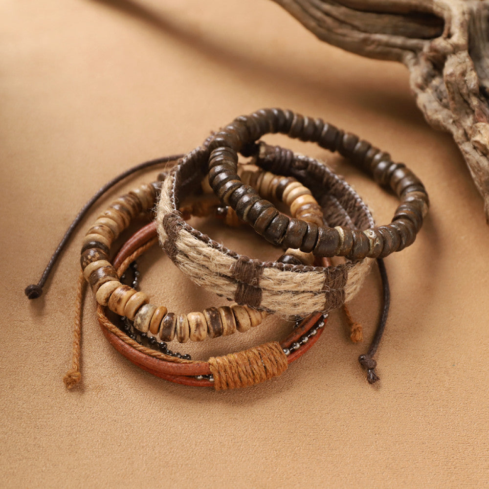 This bohemian stackable bracelet set features multiple layered strands in earthy tones, including turquoise, dark brown, green, and light brown beads, accented with decorative silver elements. The mix of natural materials and ethnic-inspired details creates a rich, textured look, perfect for layering to elevate casual outfits 07