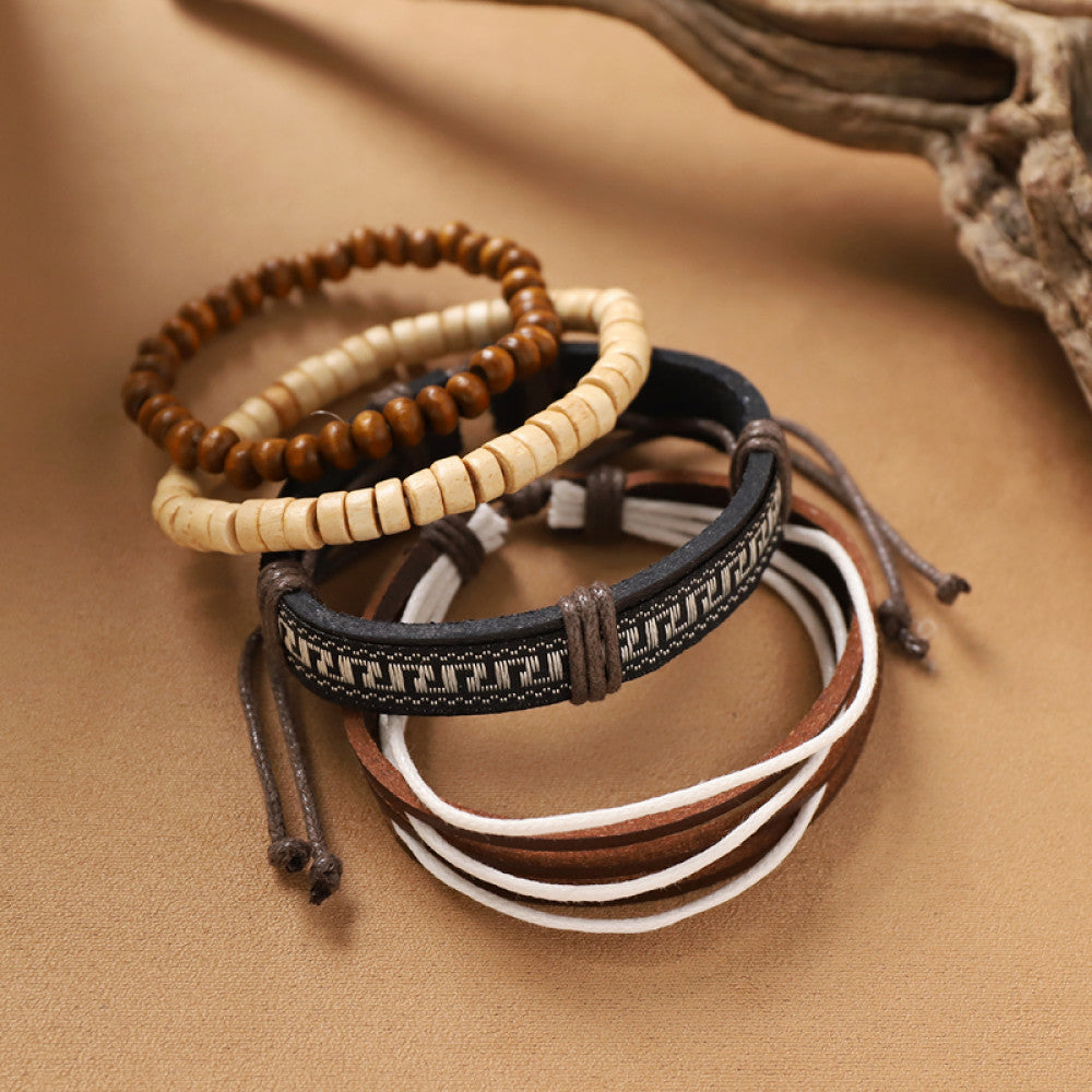 This bohemian stackable bracelet set features multiple layered strands in earthy tones, including turquoise, dark brown, green, and light brown beads, accented with decorative silver elements. The mix of natural materials and ethnic-inspired details creates a rich, textured look, perfect for layering to elevate casual outfits 12