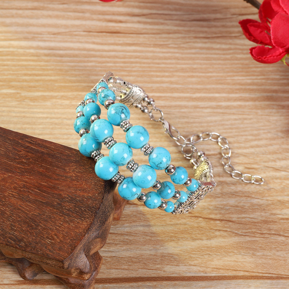 Vintage bohemian ethnic colorful beaded bracelet with multi-color stone beads and silver accents, displayed on a wooden surface, ideal for boho fashion enthusiasts 02