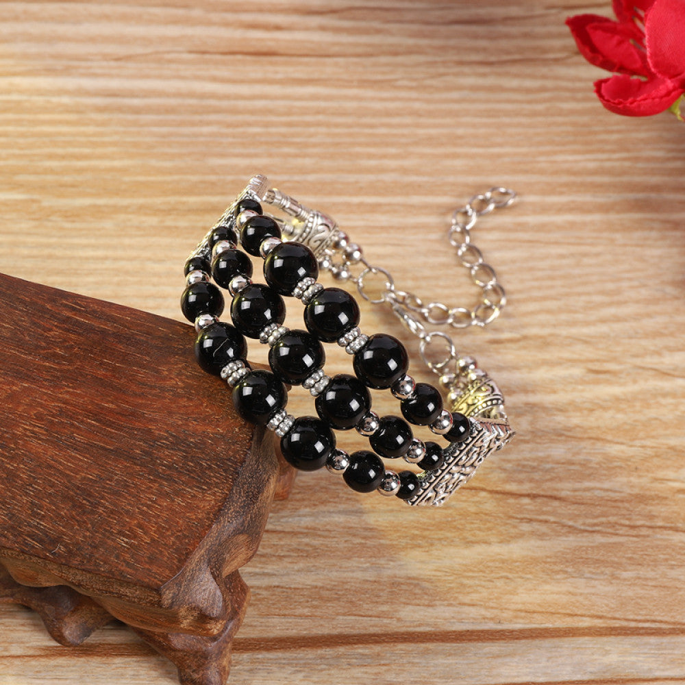 Vintage bohemian ethnic colorful beaded bracelet with multi-color stone beads and silver accents, displayed on a wooden surface, ideal for boho fashion enthusiasts 03