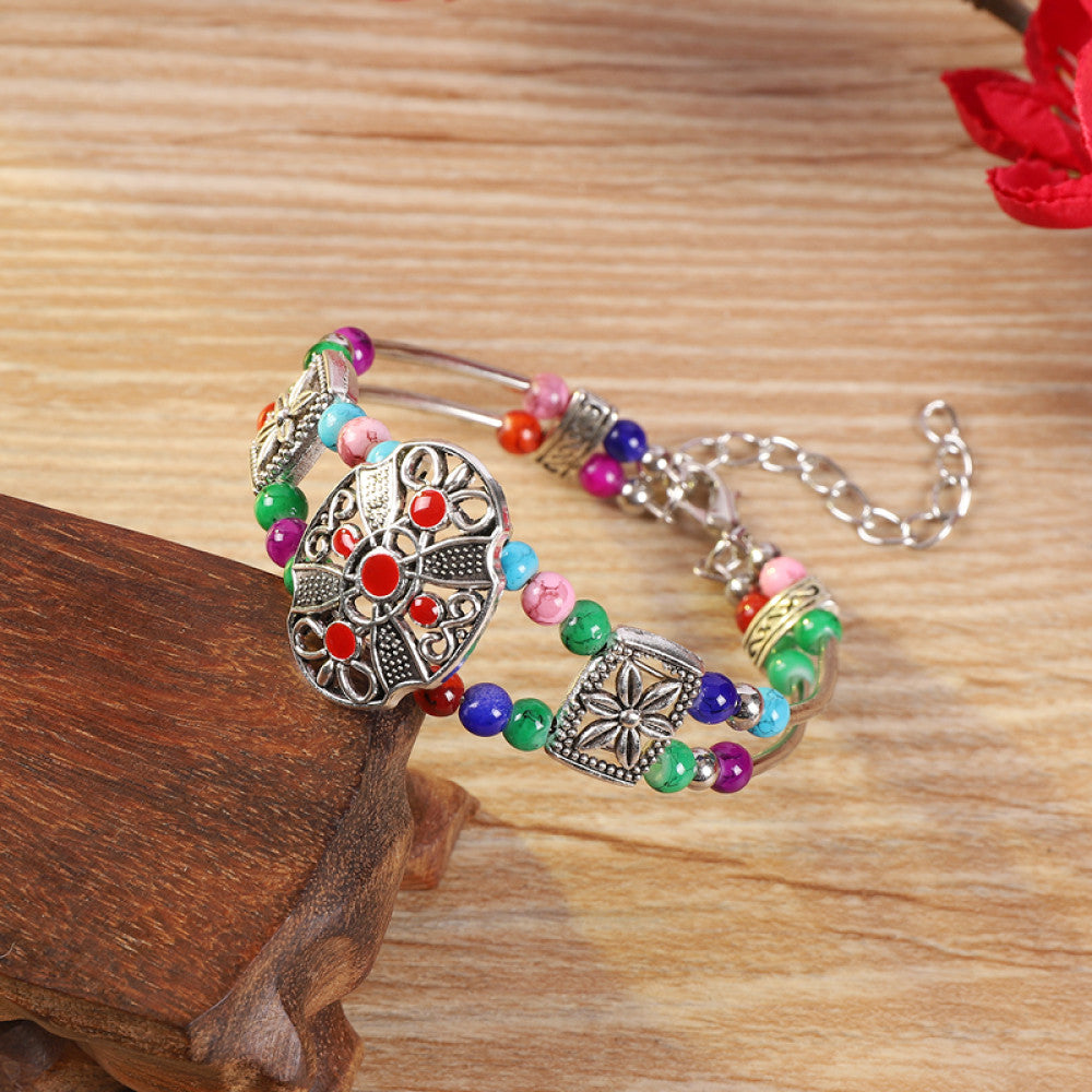Vintage bohemian ethnic colorful beaded bracelet with multi-color stone beads and silver accents, displayed on a wooden surface, ideal for boho fashion enthusiasts 04