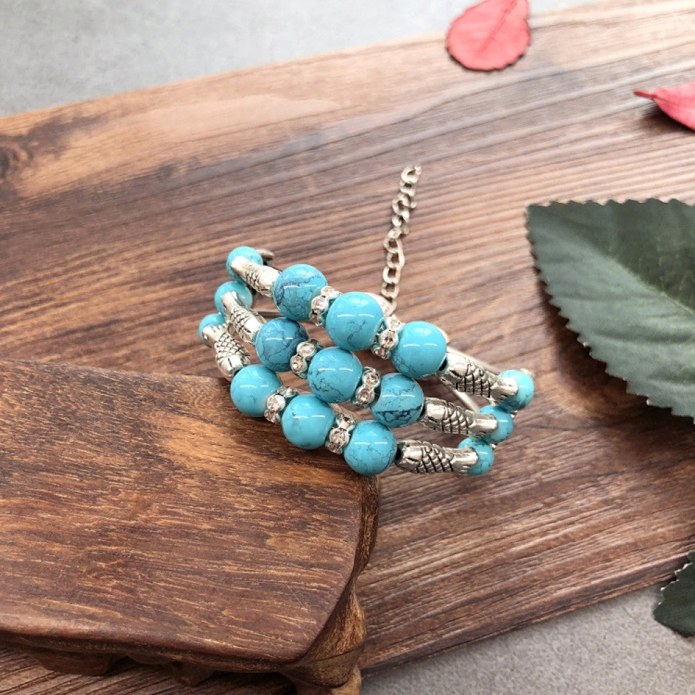 Vintage bohemian ethnic colorful beaded bracelet set with silver fish accents, displayed on a wooden surface, ideal for boho fashion enthusiasts 03