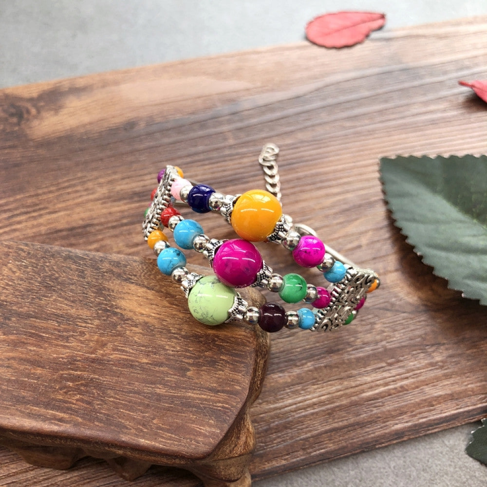 Vintage bohemian ethnic colorful beaded bracelet set with silver fish accents, displayed on a wooden surface, ideal for boho fashion enthusiasts 04