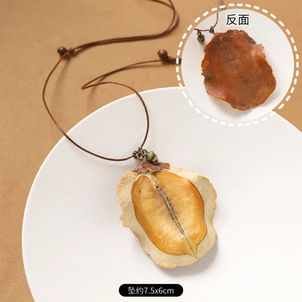 Vintage bohemian ethnic necklace with round natural stone pendant, featuring earthy brown tones and cord design, displayed on a neutral background with linen accent, ideal for boho fashion enthusiasts 01