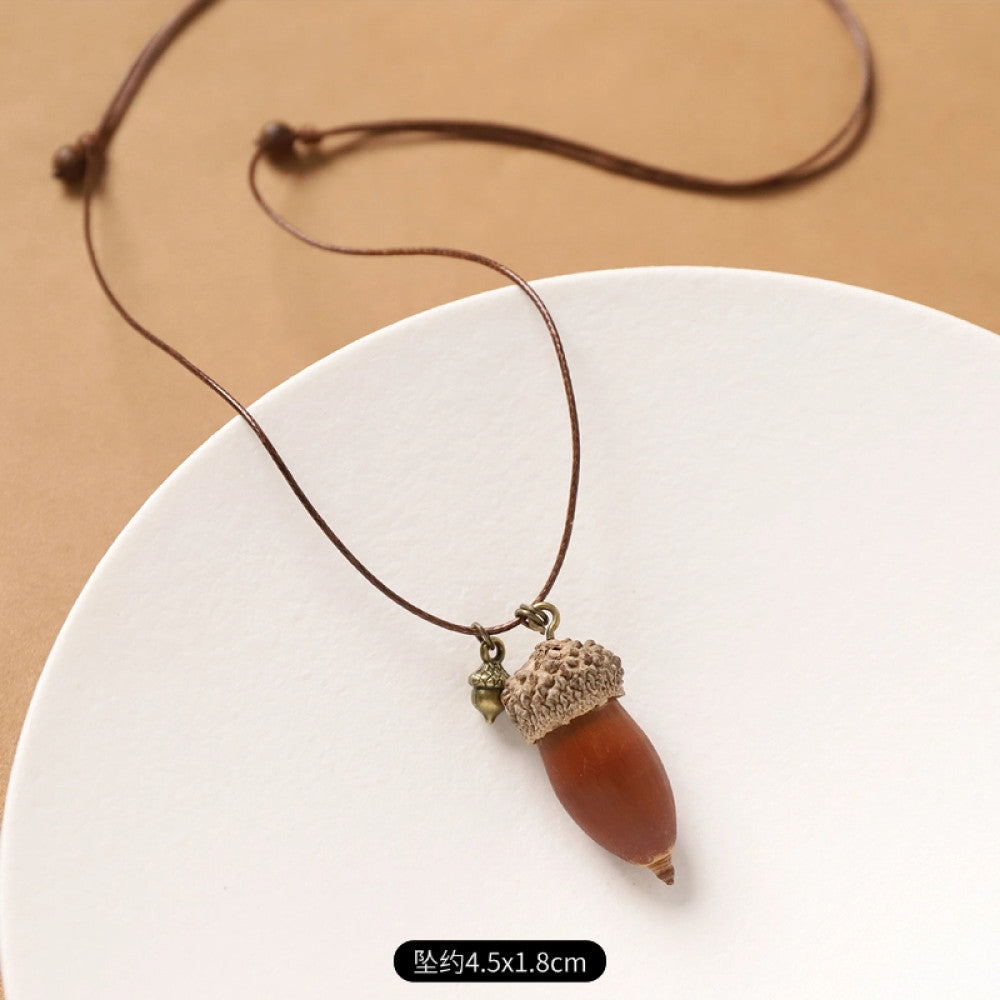 Vintage bohemian ethnic necklace with round natural stone pendant, featuring earthy brown tones and cord design, displayed on a neutral background with linen accent, ideal for boho fashion enthusiasts 04