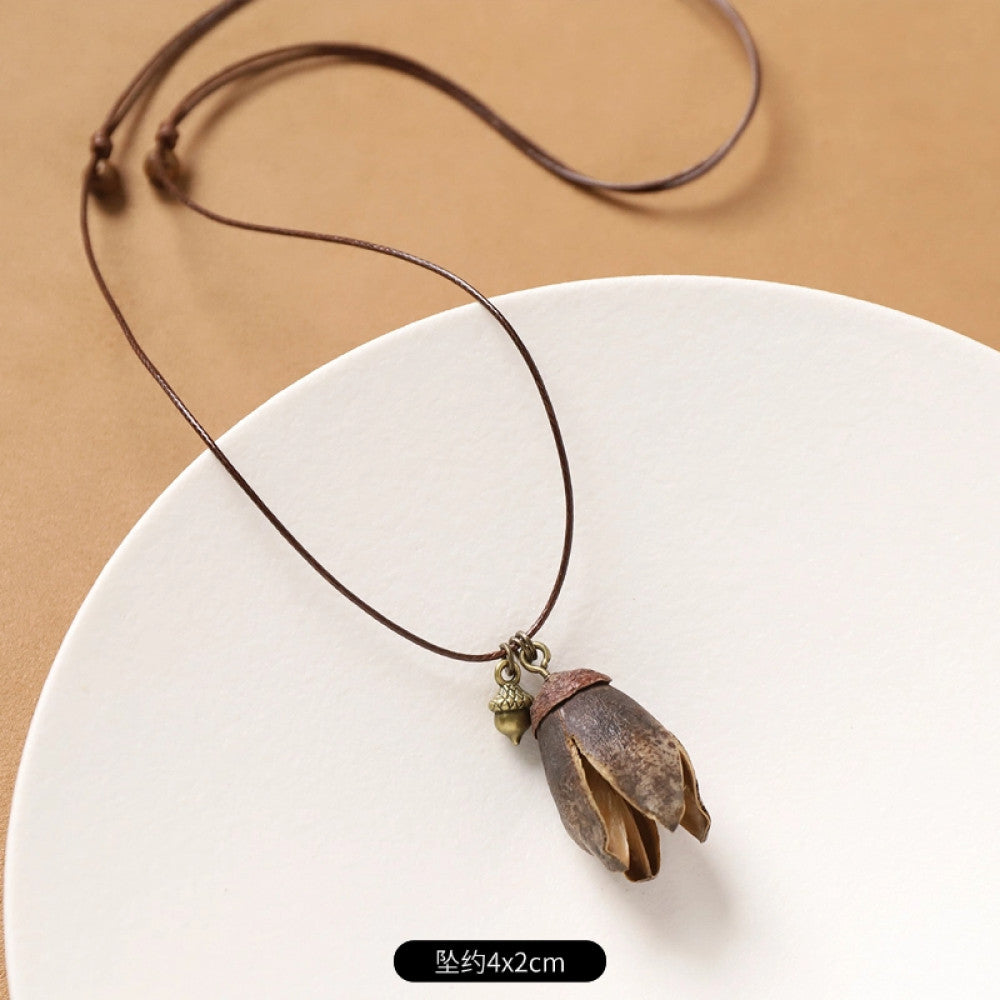 Vintage bohemian ethnic necklace with round natural stone pendant, featuring earthy brown tones and cord design, displayed on a neutral background with linen accent, ideal for boho fashion enthusiasts 15