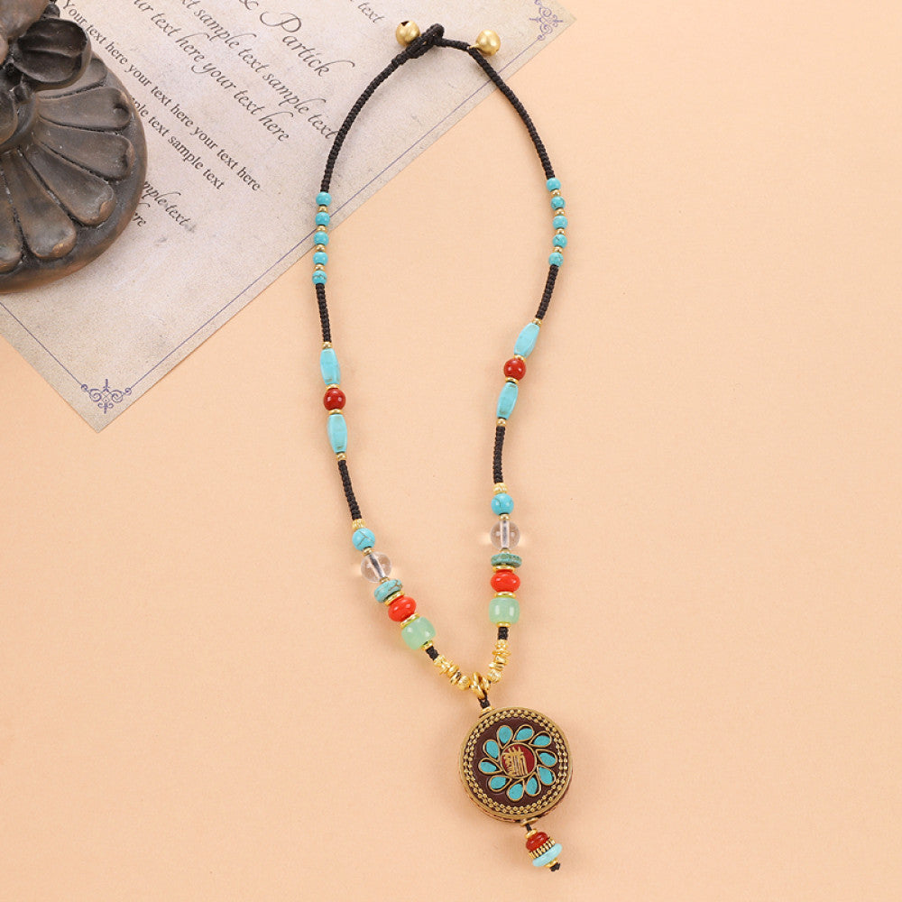 Vintage bohemian ethnic tribal beaded necklace with intricate colorful pendant and multi-color beads, ideal for boho fashion, displayed on a neutral background with vintage paper accent 01