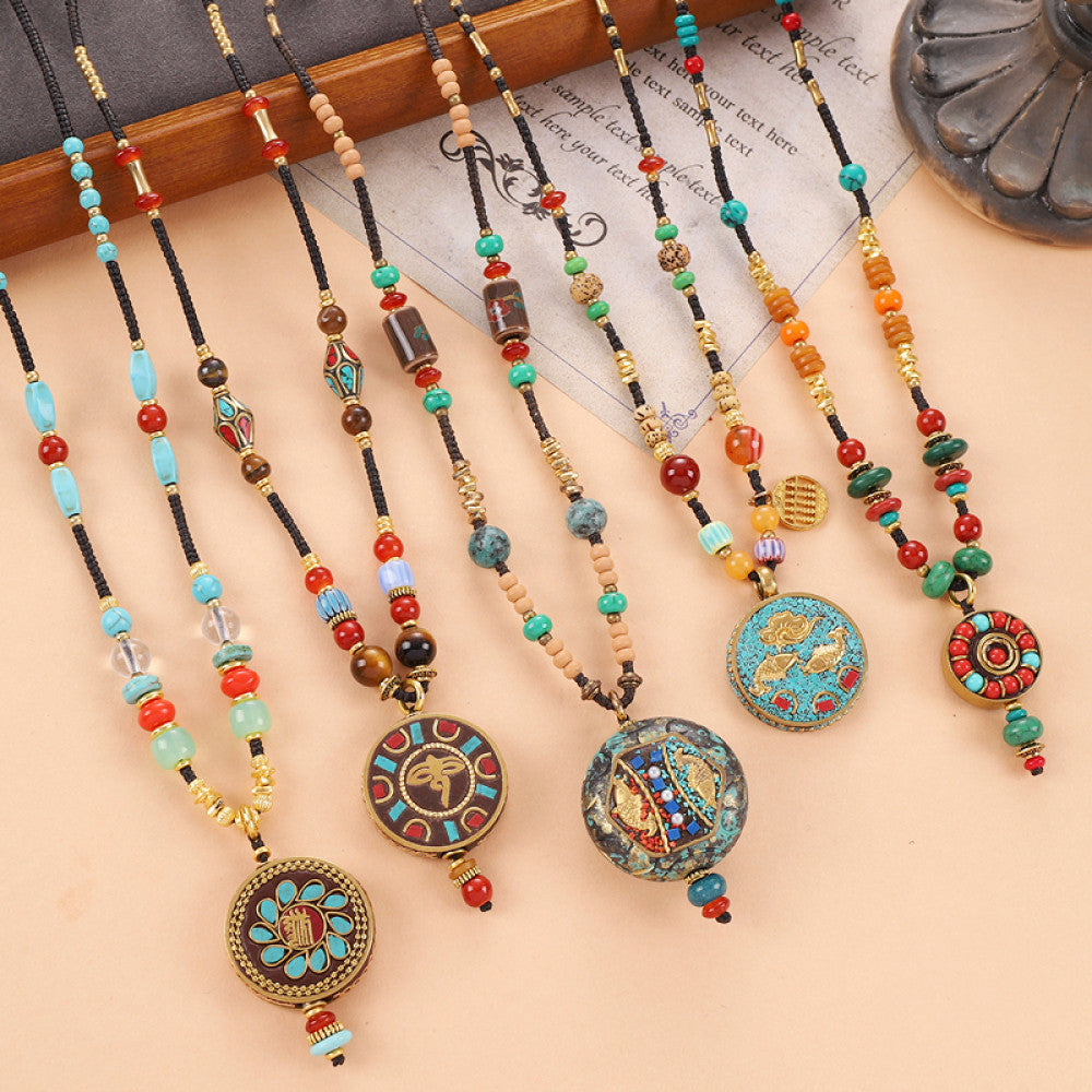 Vintage bohemian ethnic tribal beaded necklace with intricate colorful pendant and multi-color beads, ideal for boho fashion, displayed on a neutral background with vintage paper accent 07