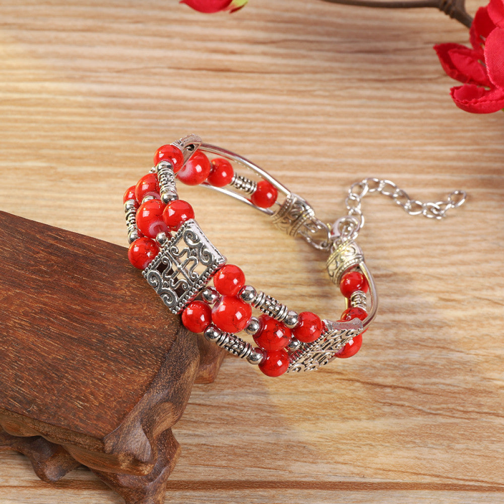 Vintage bohemian ethnic bracelet with turquoise beads and silver leaf accents, displayed on a wooden surface, ideal for boho fashion enthusiasts 04