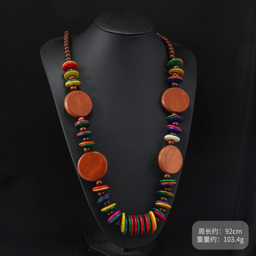 Vintage bohemian multi-layer wood beaded necklace with turquoise and colorful accents, featuring intricate layered design, ideal for ethnic tribal and boho fashion, displayed on a black mannequin against a dark background 06