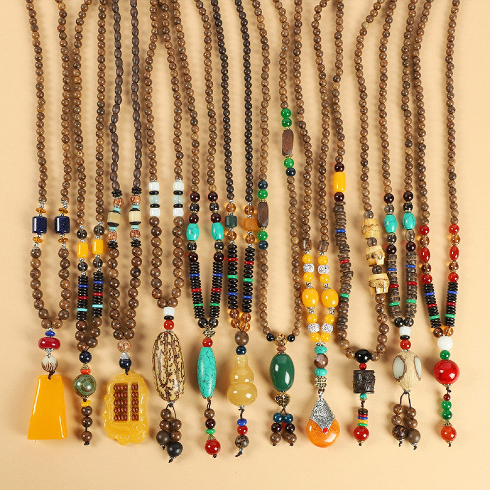 Assorted bohemian vintage multi-style ethnic beaded necklace set with diverse pendants and colorful beads, ideal for boho fashion enthusiasts, displayed against a neutral background