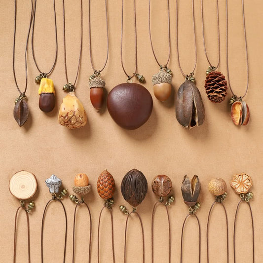 Assorted bohemian vintage natural element necklace set with acorn, pinecone, seed, and floral pendants, displayed against a neutral background, ideal for boho and nature-inspired fashion enthusiasts 01