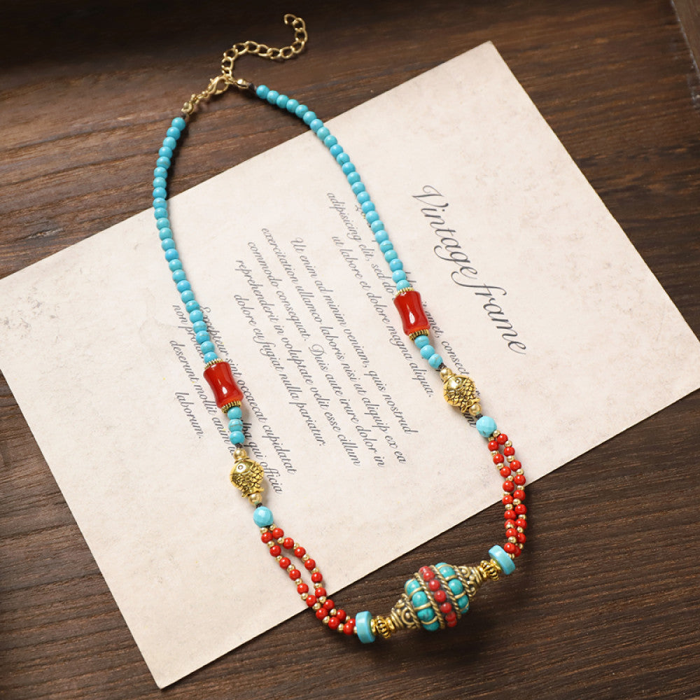 Vintage tribal-style necklace with turquoise and red beads, featuring a mix of geometric and round bead designs, ideal for bohemian fashion, showcased on vintage paper with elegant typography 02
