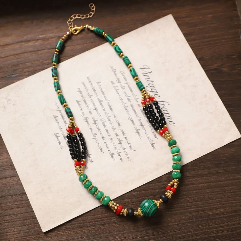 Vintage tribal-style necklace with turquoise and red beads, featuring a mix of geometric and round bead designs, ideal for bohemian fashion, showcased on vintage paper with elegant typography 08