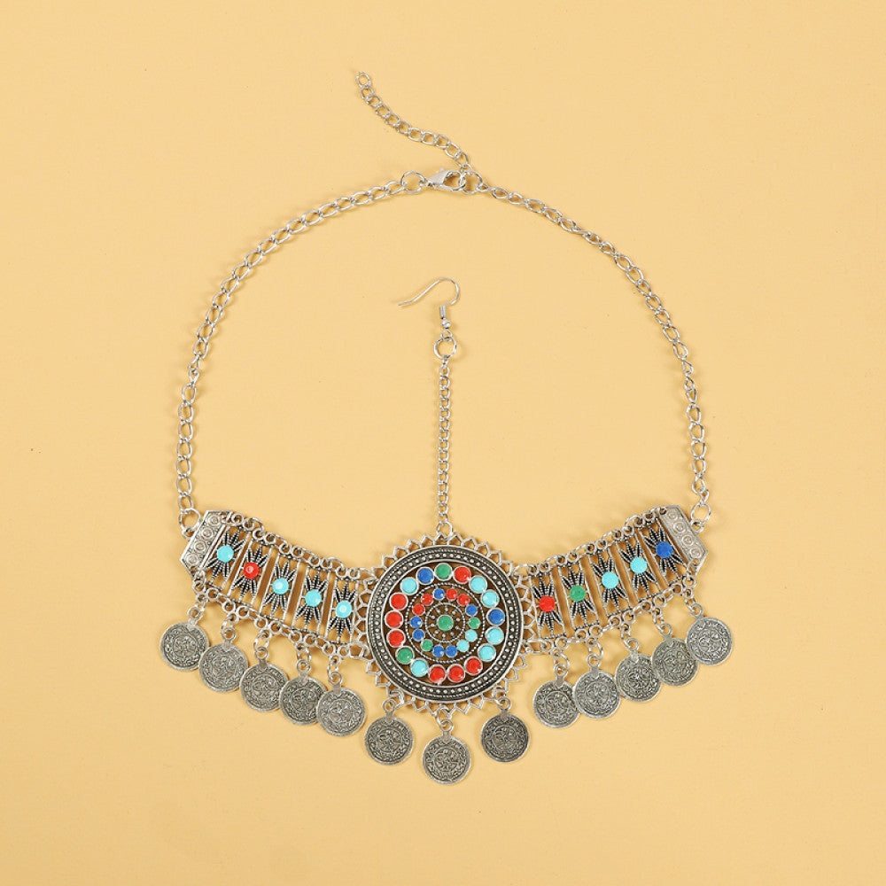 Boho ethnic silver-tone choker necklace featuring a vibrant colorful mosaic centerpiece, turquoise/gemstone decorative accents, and layered coin tassel pendants, displayed on a light yellow background, ideal for bohemian and festival fashion enthusiasts in the US