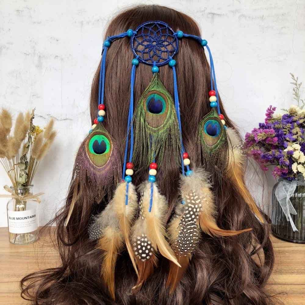 Boho leather cord hair band featuring a vibrant peacock feather, multi color feather tassels, and bead accents displayed on a wooden surface with dried fresh flower arrangements, ideal for bohemian festival fashion enthusiasts in the US 02