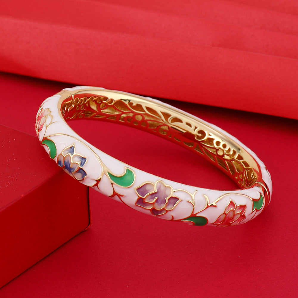 Boho vintage Chinese cloisonné enamel bangle with pink floral design and gold plating, styled on red background, ideal for ethnic and bohemian fashion enthusiasts in the US 03