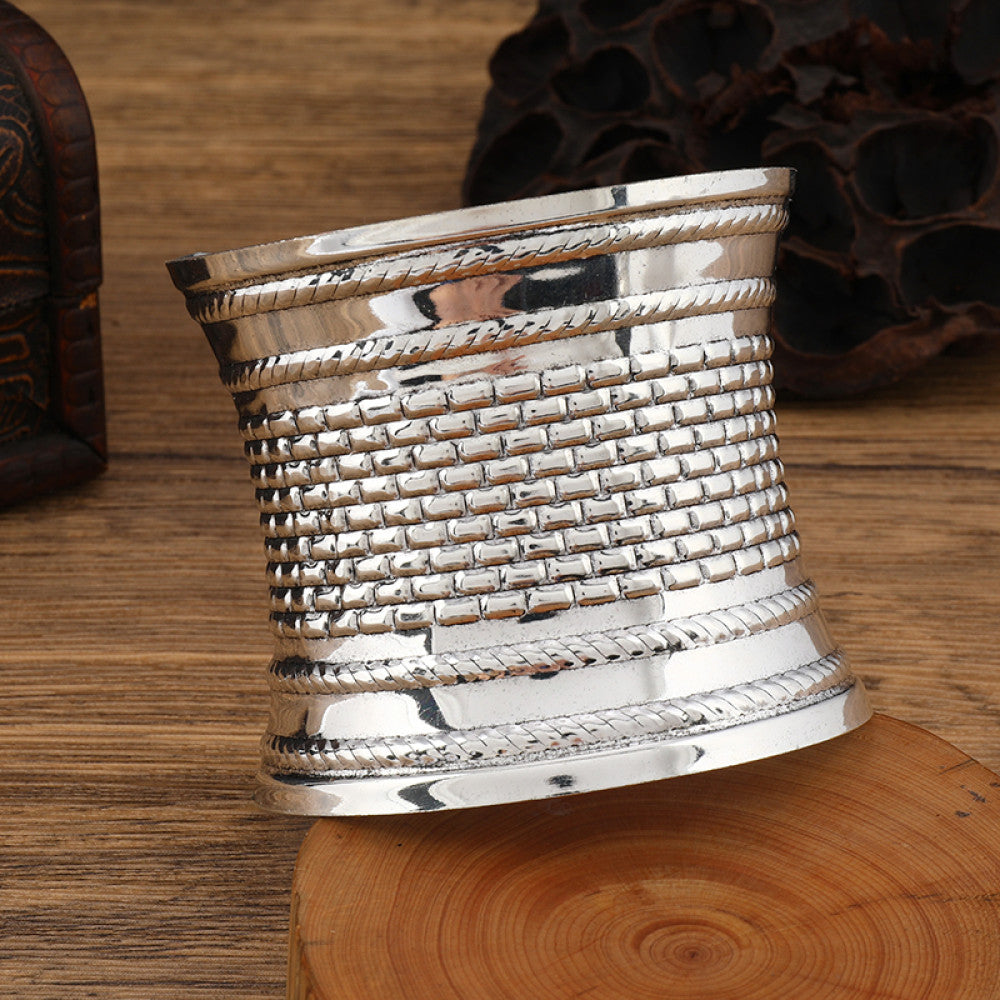 Boho vintage ethnic engraved silver cuff bangle with intricate floral designs, styled on wooden surface, ideal for bohemian and tribal fashion enthusiasts in the US 07