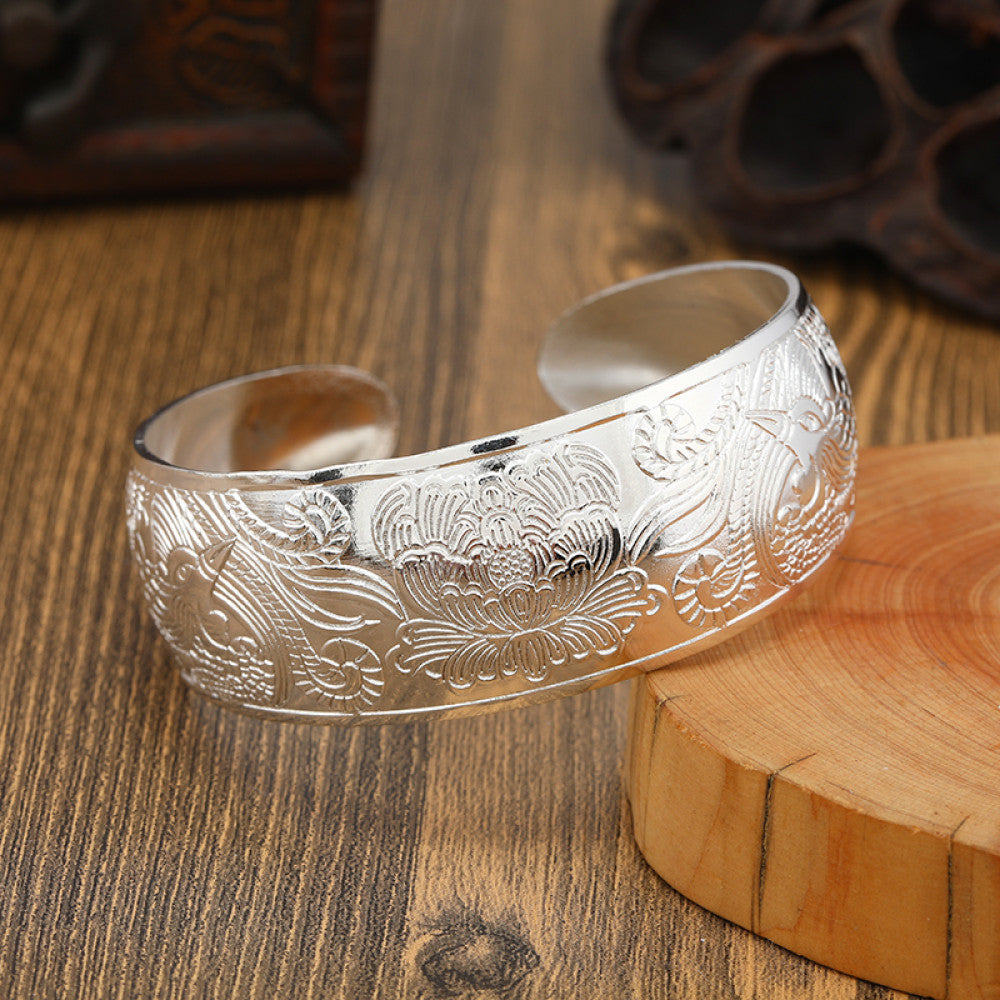 Boho vintage ethnic engraved silver cuff bangle with intricate floral designs, styled on wooden surface, ideal for bohemian and tribal fashion enthusiasts in the US 07