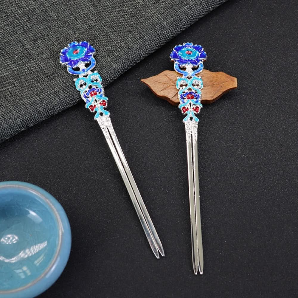 Pair of boho vintage ethnic gold-tone double hair sticks, featuring vibrant colorful enamel and gemstone accents, displayed on a dark fabric background 01