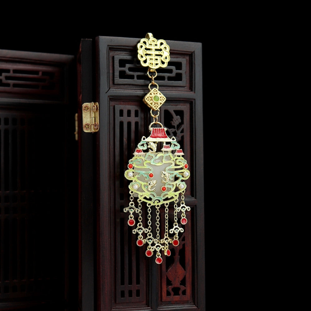 Boho vintage ethnic gold-tone hair pendant featuring intricate Chinese knot clasp, palace-style decorative pendant with red enamel details, and layered red beaded tassels, styled on a wooden display hook against a black background, ideal for bohemian and traditional fashion enthusiasts in the US 03