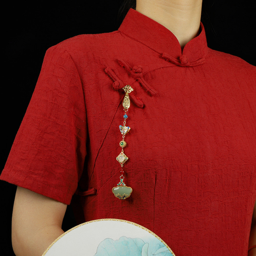 Boho vintage ethnic gold-tone hair pendant featuring multi-color gemstone (blue/green/red) accents, intricate enamel decorations, and a jade-inlaid ruyi lock-shaped pendant, styled on a wooden display hook against a black background, ideal for bohemian and traditional fashion enthusiasts in the US 01