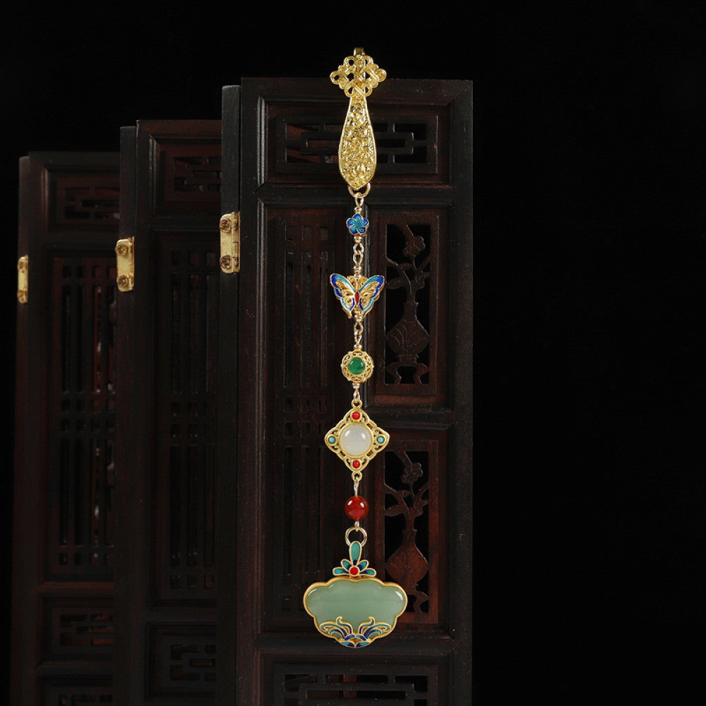 Boho vintage ethnic gold-tone hair pendant featuring multi-color gemstone (blue/green/red) accents, intricate enamel decorations, and a jade-inlaid ruyi lock-shaped pendant, styled on a wooden display hook against a black background, ideal for bohemian and traditional fashion enthusiasts in the US 02