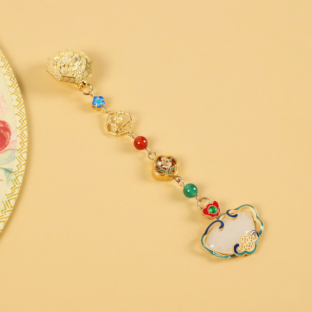 Boho vintage ethnic gold-tone hair pendant featuring intricate gold decorative clasp, blue/red/green gemstone accents, and an enamel-inlaid lock pendant with white texture, styled on a wooden display hook against a black background, ideal for bohemian and traditional fashion enthusiasts in the US 05