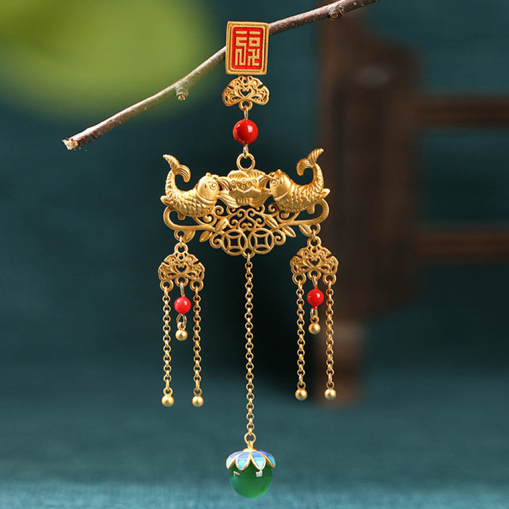 Boho vintage ethnic gold-tone hair pendant featuring red double happiness charm, intricate gold decorative details, red bead accents and a green beaded pendant, styled on a twig against a teal background, ideal for bohemian and traditional fashion enthusiasts in the US