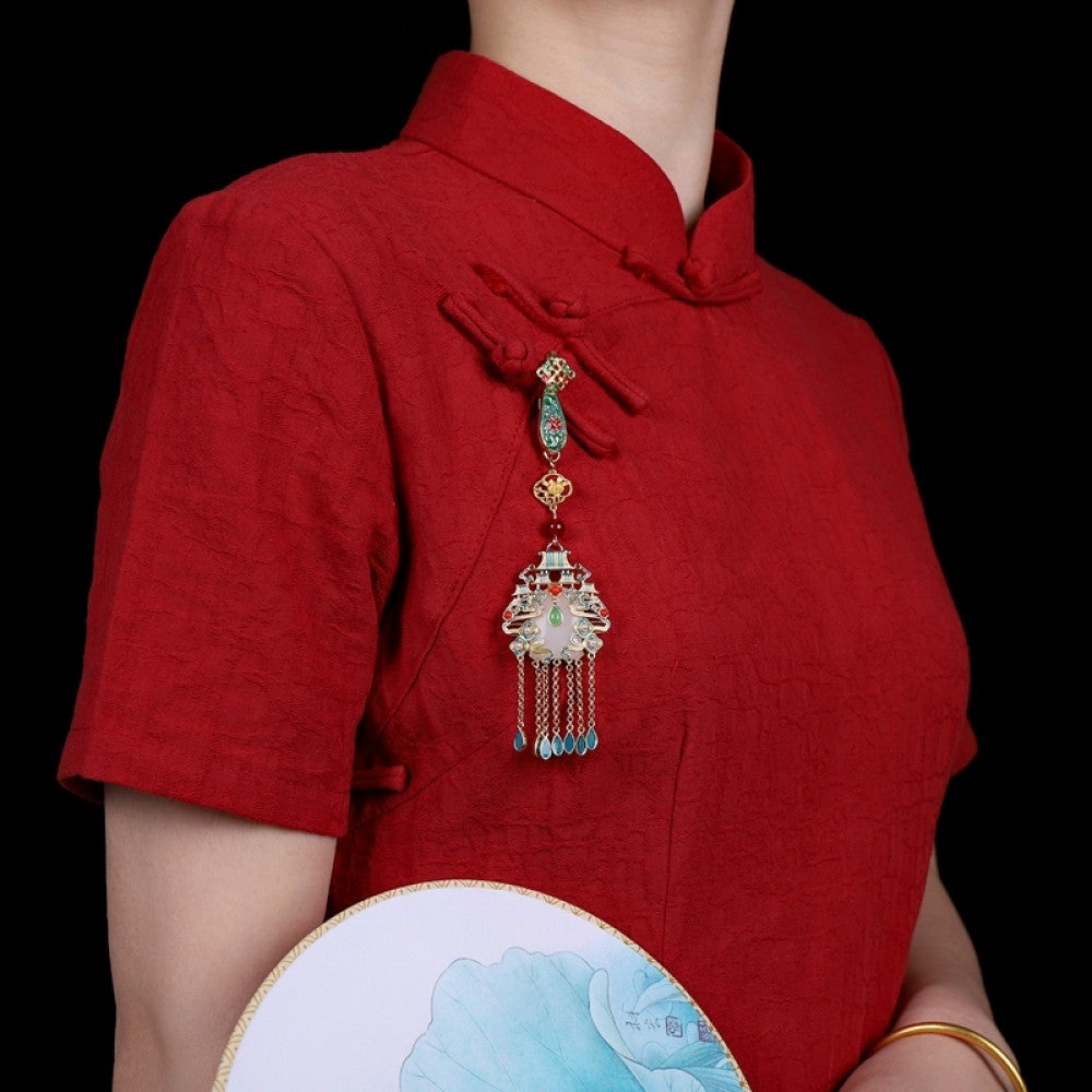 Boho vintage ethnic gold-tone hair pendant featuring colorful enamel accents, white gemstone center, palace-style charm and turquoise tassel details, styled on a wooden display hook, ideal for bohemian and traditional fashion enthusiasts in the US 01