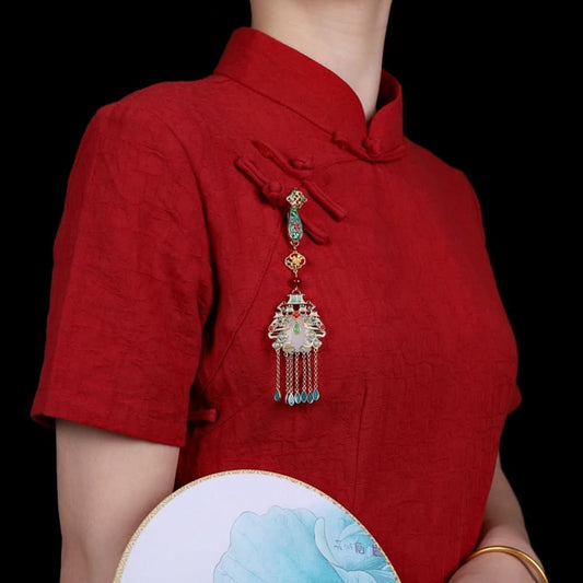 Boho vintage ethnic gold-tone hair pendant featuring colorful enamel accents, white gemstone center, palace-style charm and turquoise tassel details, styled on a wooden display hook, ideal for bohemian and traditional fashion enthusiasts in the US 01