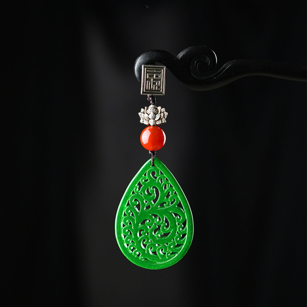 Boho vintage ethnic green cutout hair pendant charm featuring red bead and fu character detail, styled on a display hook, ideal for bohemian and traditional fashion enthusiasts in the US