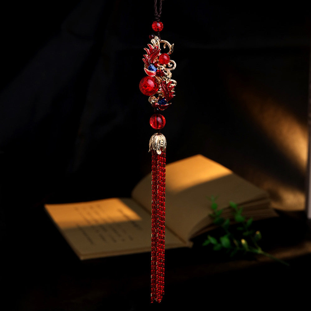 Boho vintage ethnic red-tone hair pendant featuring black cord, intricate red dragon charm (with decorative details), red bead accents, and long red-gold fringe tassels, styled against a black fabric background, ideal for bohemian and traditional fashion enthusiasts in the US 02