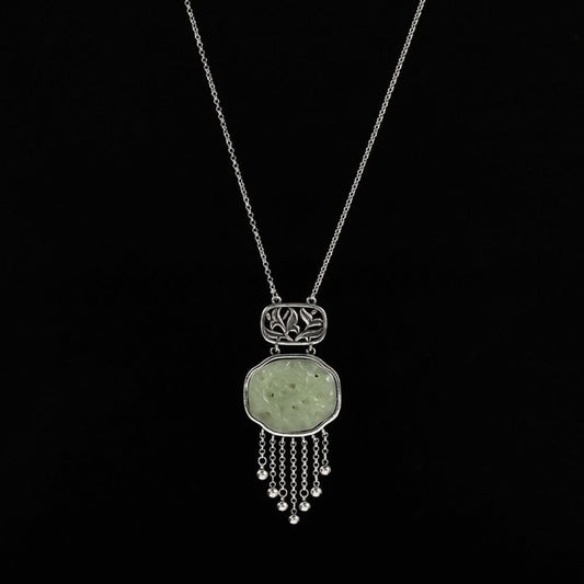 Boho vintage ethnic silver hair pendant with jade-inlaid openwork charm and silver tassel details, styled on a wooden display hook, ideal for bohemian and traditional fashion enthusiasts in the US 01