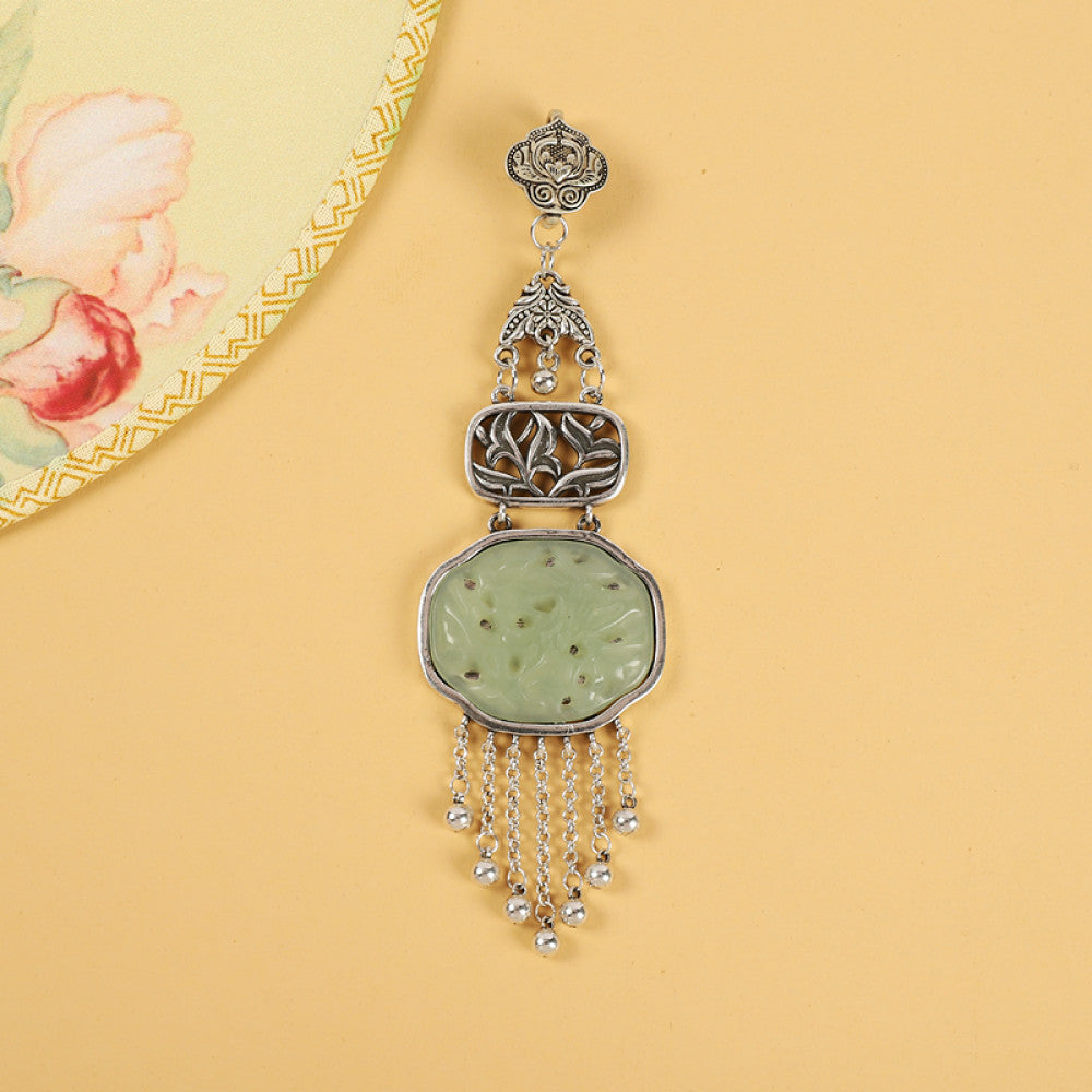 Boho vintage ethnic silver hair pendant with jade-inlaid openwork charm and silver tassel details, styled on a wooden display hook, ideal for bohemian and traditional fashion enthusiasts in the US 04
