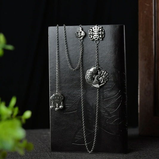 Boho vintage ethnic silver long chain statement pendant with carved charm and bell details, styled on a display hook, ideal for bohemian and traditional fashion enthusiasts in the US 01