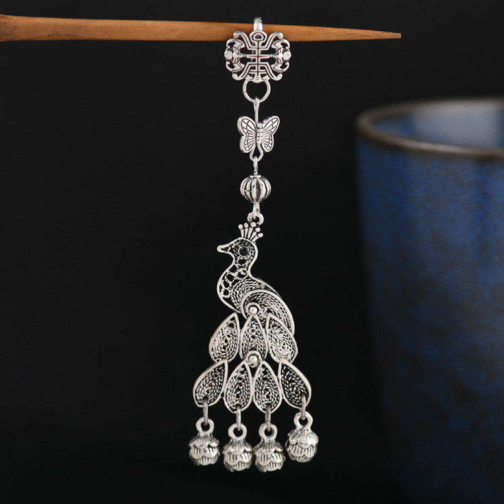 Boho vintage ethnic silver hair stick featuring a peacock and bell charms, styled on a stick, ideal for bohemian and traditional fashion enthusiasts in the US