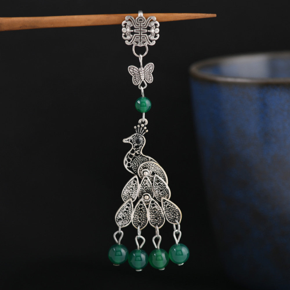 Boho vintage ethnic silver hair stick featuring a peacock and bell charms, styled on a stick, ideal for bohemian and traditional fashion enthusiasts in the US 01
