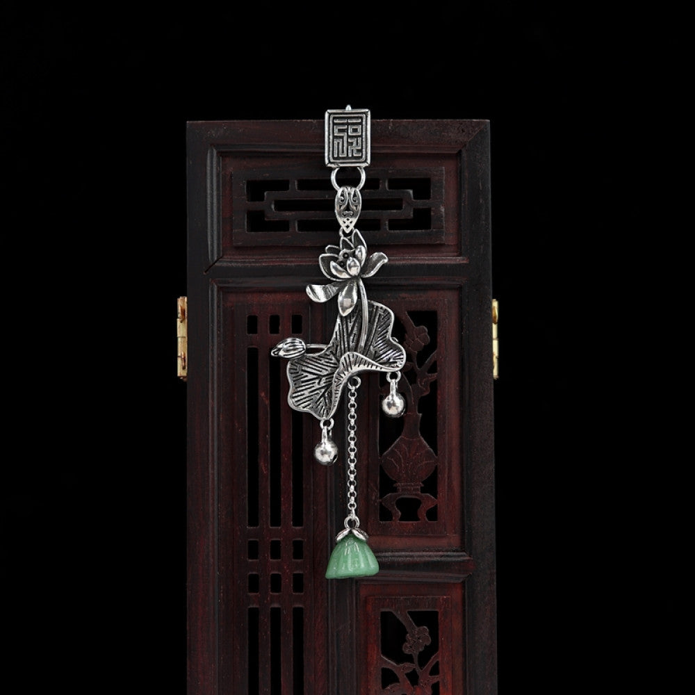Boho vintage ethnic silver hair pendant featuring fu character detail, opera character-shaped charm and green tassel, styled on a wooden display hook, ideal for bohemian and traditional fashion enthusiasts in the US 02