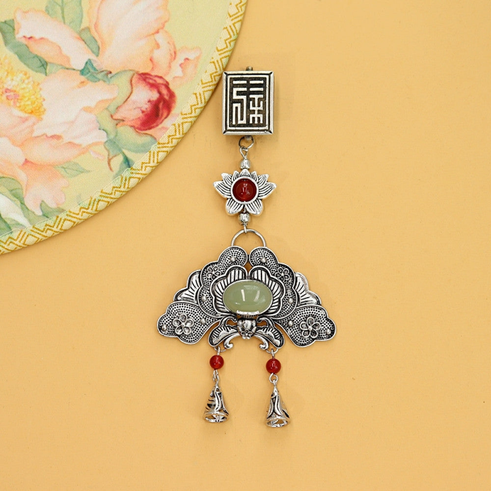 Boho vintage ethnic silver hair pendant featuring fu character, red gemstone accents, jade-inlaid fan-shaped charm and red tassel details, styled on a wooden display hook, ideal for bohemian and traditional fashion enthusiasts in the US 02