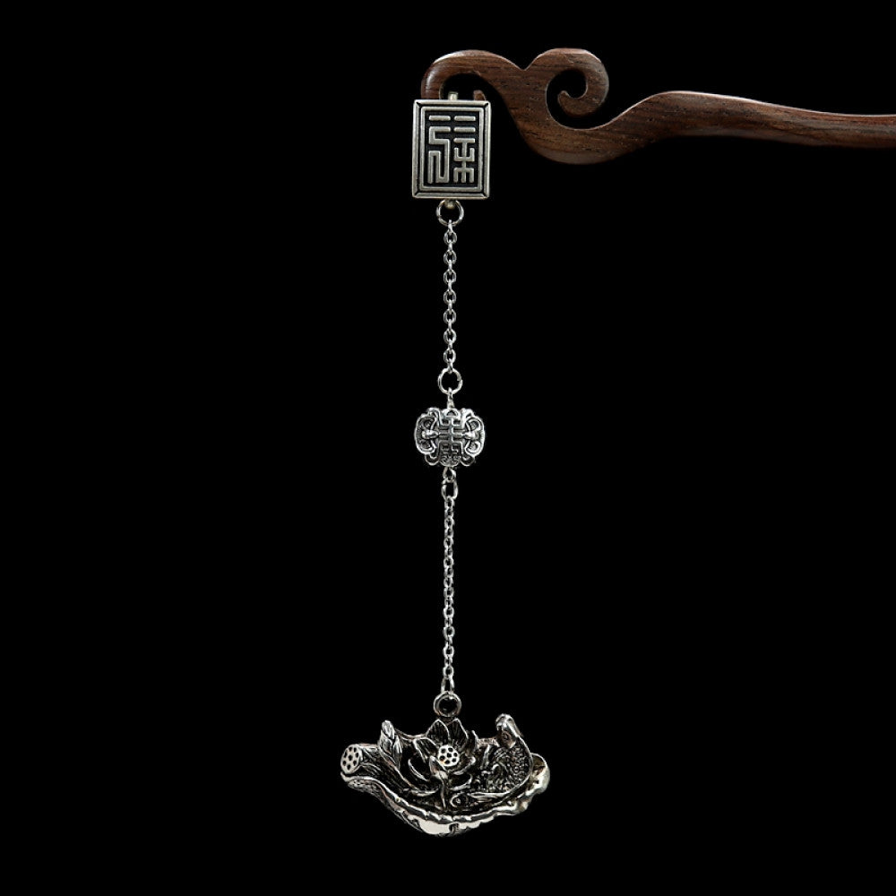 Boho vintage ethnic silver hair pendant featuring fu character detail and traditional lotus charm, styled on a wooden display hook, ideal for bohemian and traditional fashion enthusiasts in the US