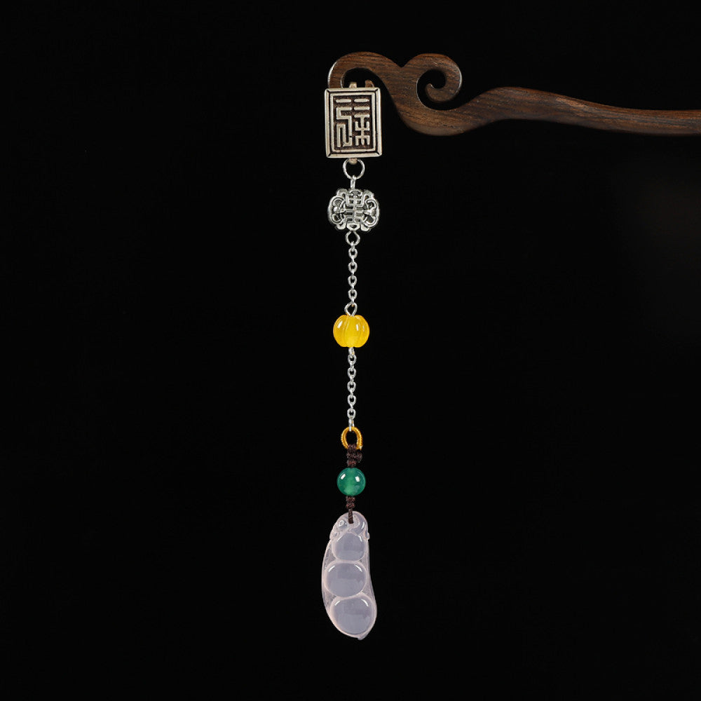 Boho vintage ethnic silver hair pendant featuring Fu character detail, yellow/red bead accents, and a jade bean-shaped charm, styled on a wooden display hook against a black background, ideal for bohemian and traditional fashion enthusiasts in the US 01
